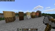 Preparing to chop some wood using an axe (Image via Minecraft)